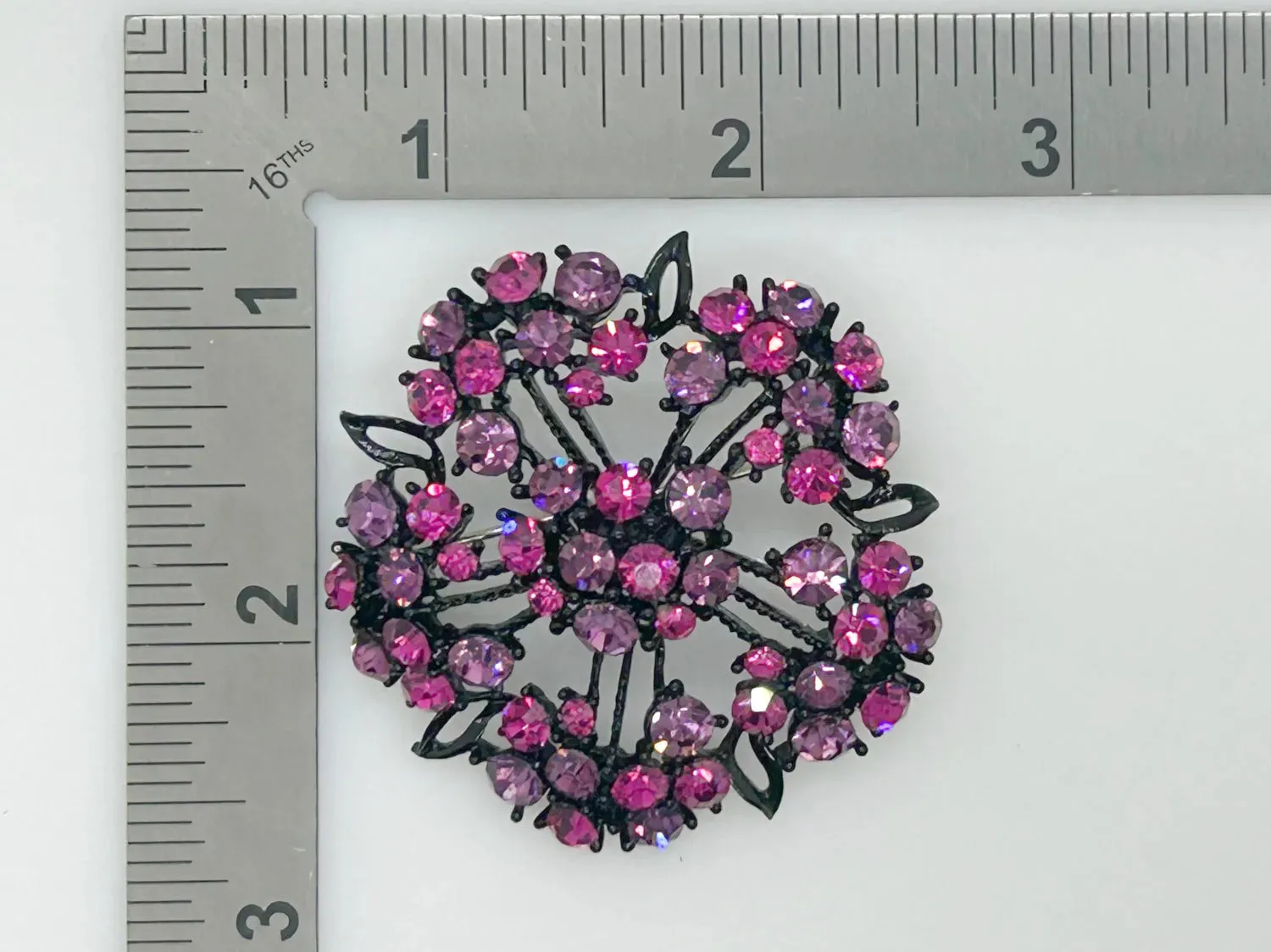Vintage Blackened Lacy Metal Brooch with Sparkling Magenta Stones
